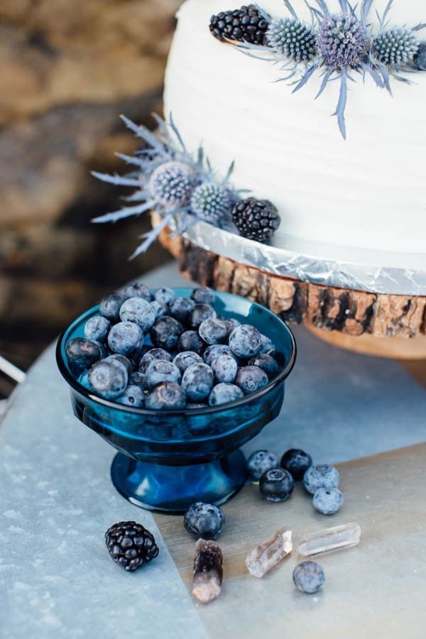 Blue and blackberry garnished wedding cake