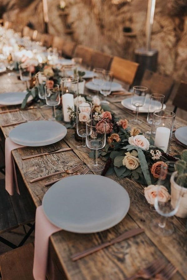 Dreamy desert inspired reception table with pink accents, romantic florals, and rose gold touches