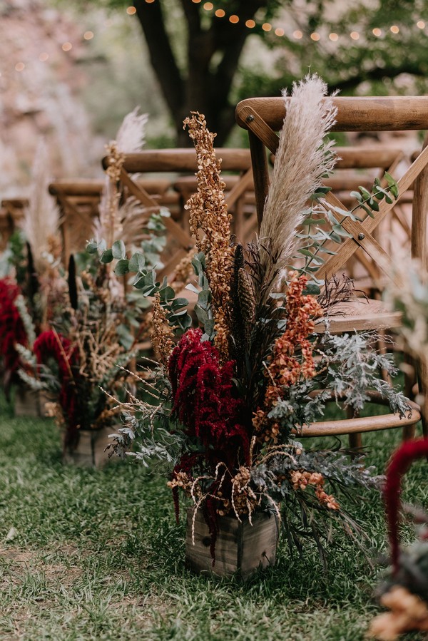 dark rust and pampas grass boho wedding aisle decoration
