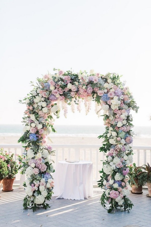 light blue and blush pink floral wedding arch
