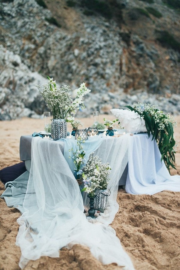 light blue and greenery beach wedding table