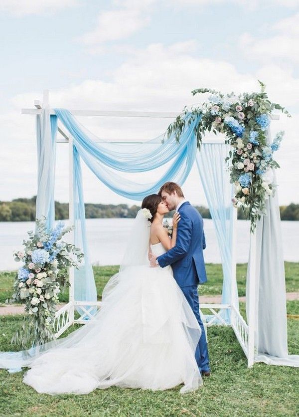 light blue and greenery wedding backdrop for spring wedding