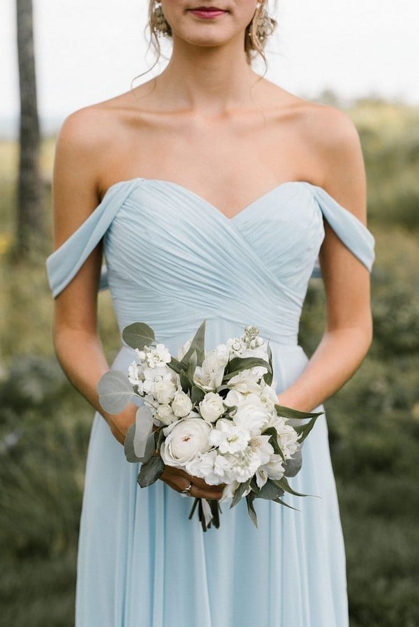 light blue off the shoulder bridesmaid dress and white bouquet