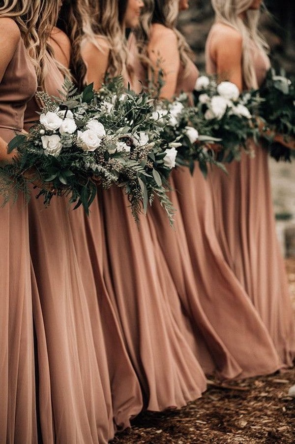 rust dusty orange bridesmaid dresses and green bouquets