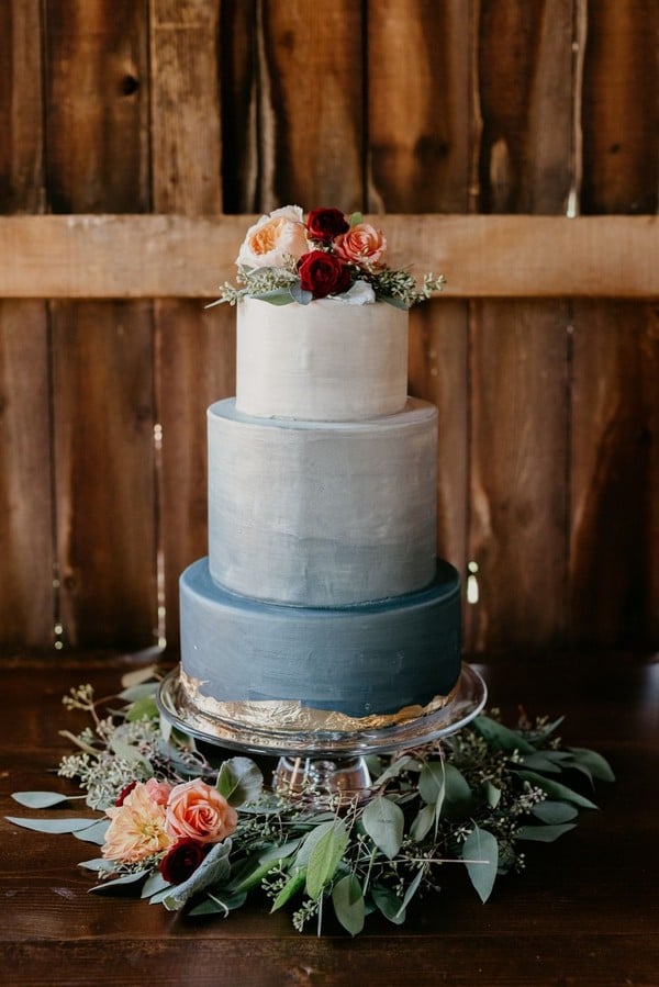 ombre dusty blue wedding cake with burgundy roses