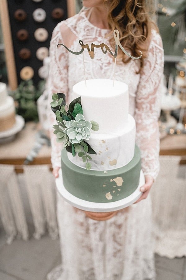 romantic sage green and white wedding cakes with glitter accents