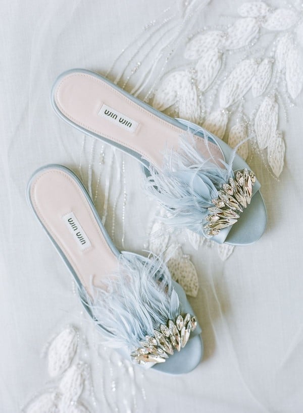 dusty blue wedding flats with feathers