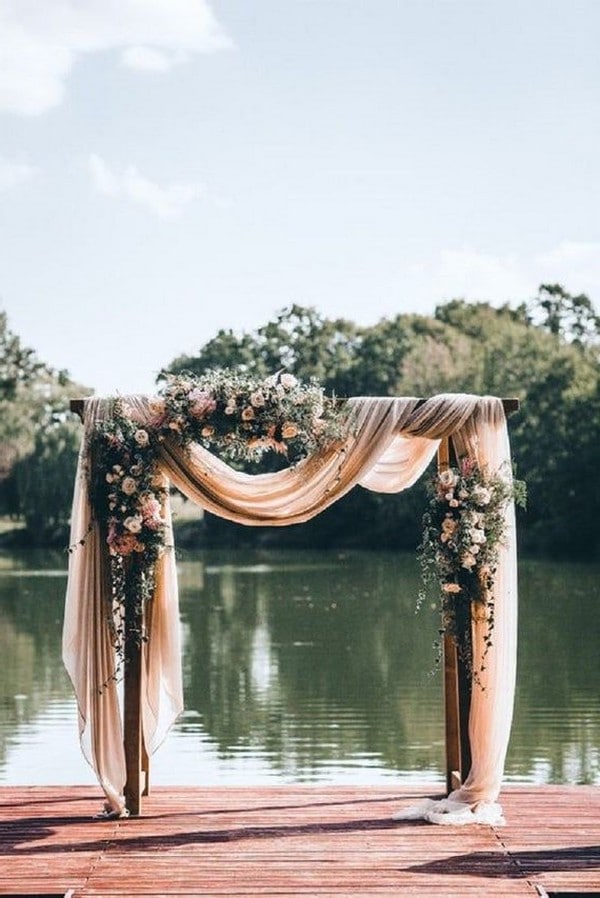 dusty rose outdoor wedding arch idea