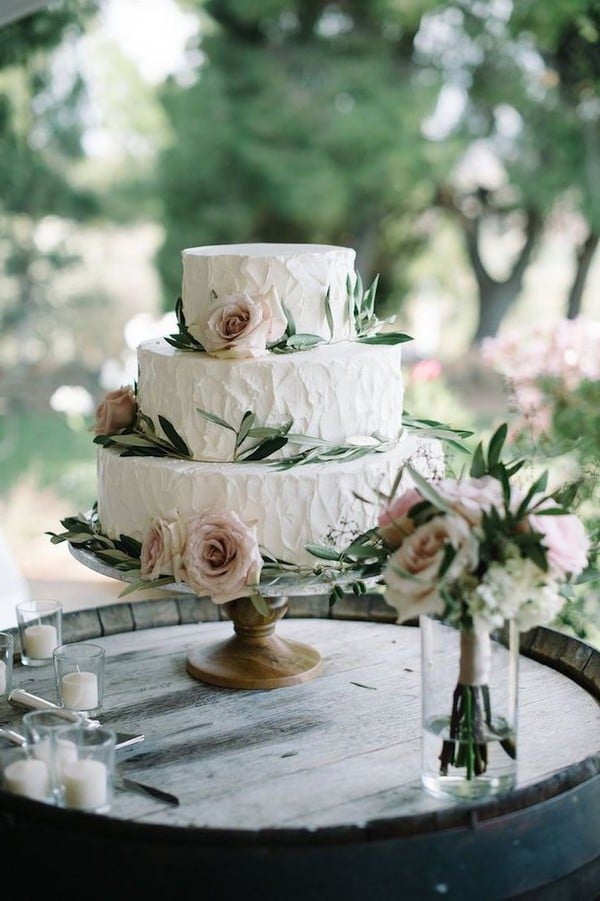 chic rustic buttercream wedding cake with olive leaves