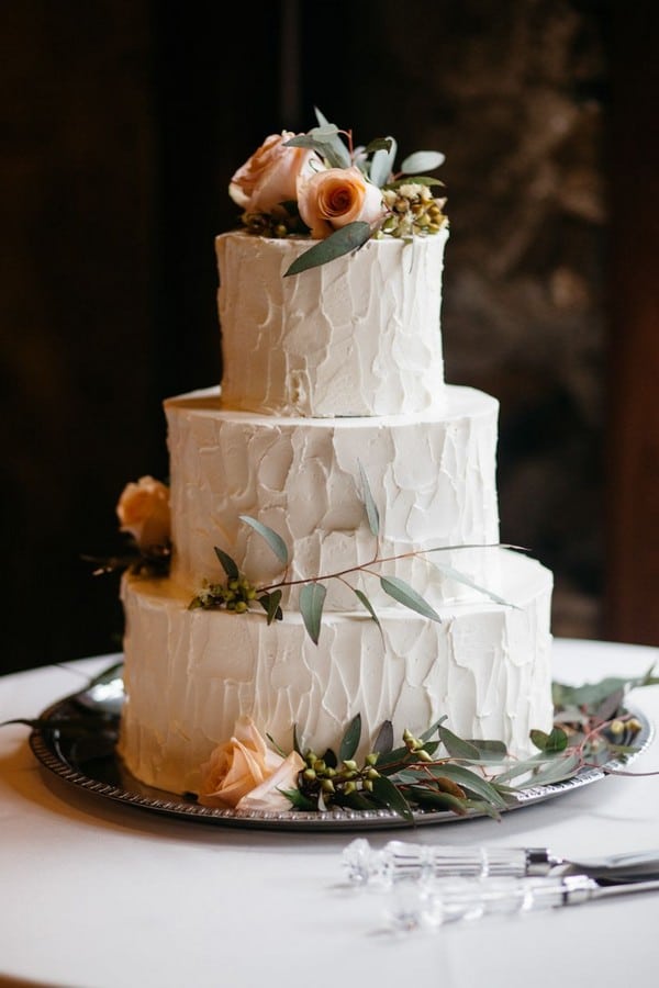 peach and greenery wedding cake