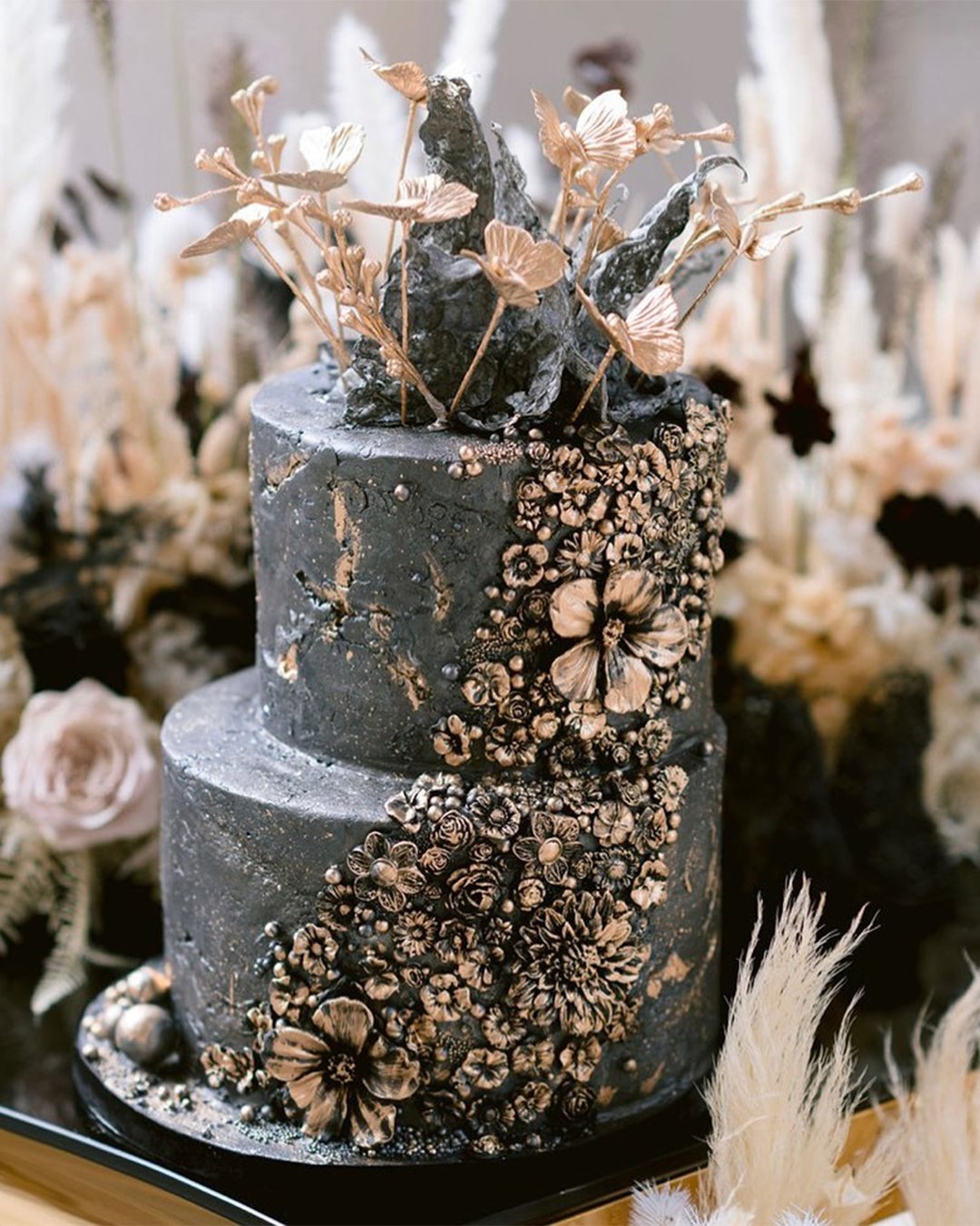 black wedding cake with gold