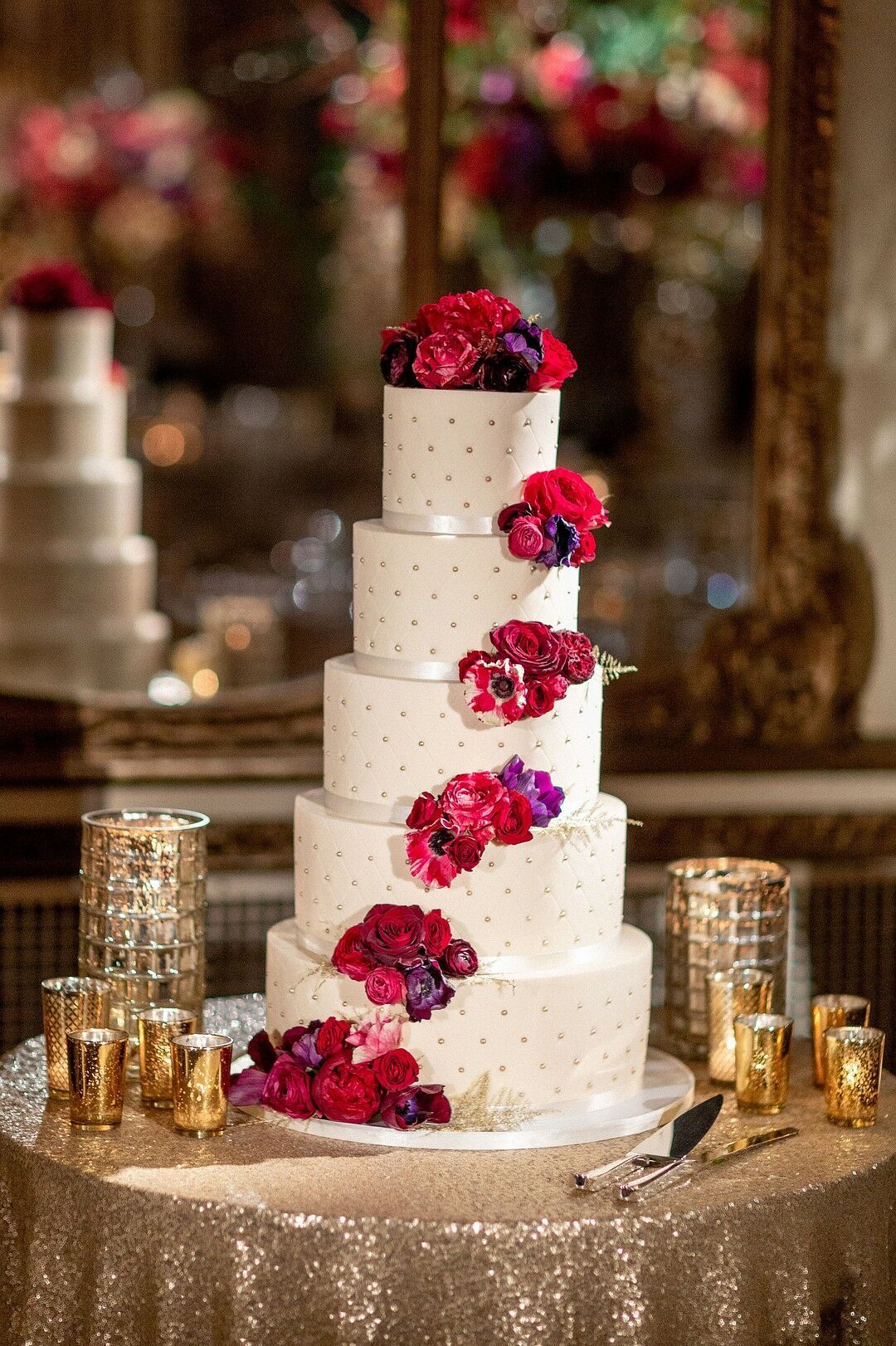 Glamorous Tiered Cake with Dotted Fondant and Red and Purple Flowers