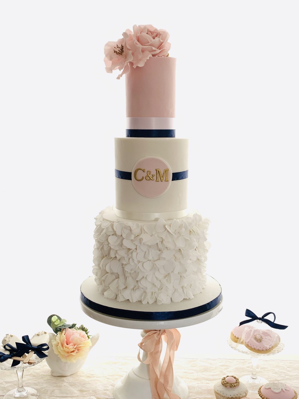 Blush pink and navy blue wedding cake